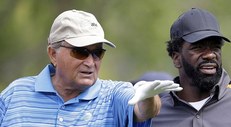 Raymond Floyd, 2014 Ryder Cup assistant captain, counsels NFL player Ed Reed during the 2013 Honda Classic pro-am.