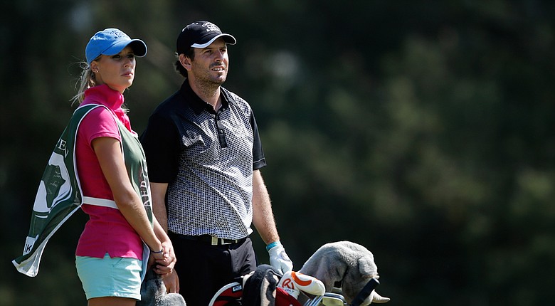Thomas Aiken with his caddie and wife, Kate, during the third round of his win at the European Tour's 2014 Africa Open.