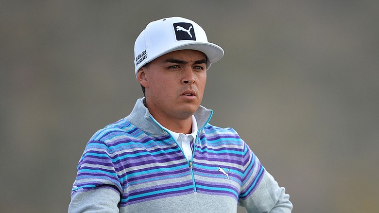 Rickie Fowler's flat bill returns after a week off at the Northern Trust Open. Fowler wore a flipped bill at The Riv.