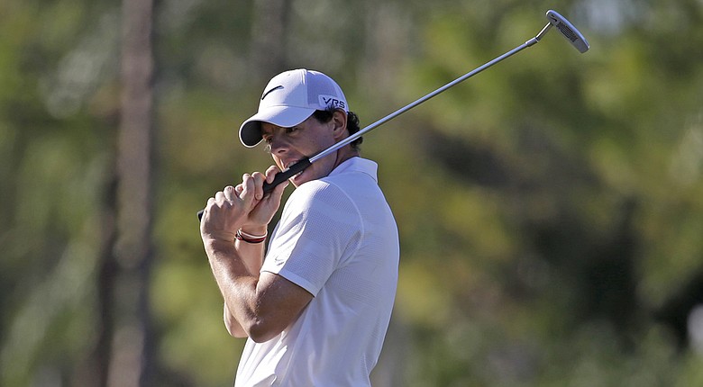 Rory McIlroy managed a 1-under 69 in windy conditions Saturday at the Honda Classic, doing just enough to hold onto his lead at PGA National.