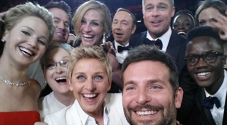 2014 Academy Awards host Ellen DeGeneres (front left) is surrounded by Hollywood stars including Bradley Cooper (front center), who took the "selfie" that garnered millions of retweets.