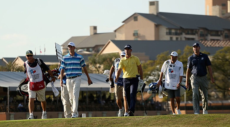 Matt Kuchar, Billy Horschel and Chesson Hadley walk from the 11th tee during the first round of the Valero Texas Open.
