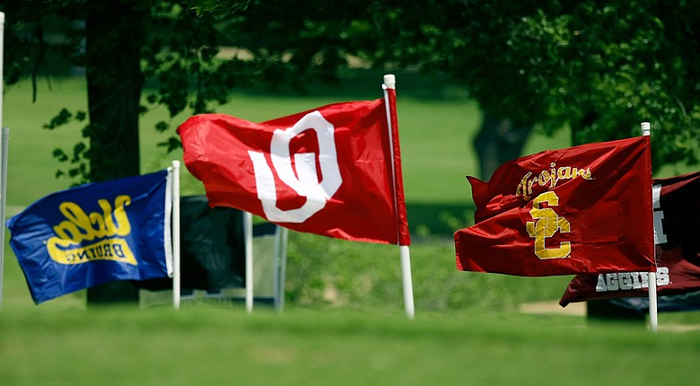 Team flags fly during the 2014 NCAA women's championship at Tulsa Country Club.