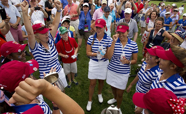 U.S. captain Ellen Port (left) celebrates with her team after regaining the Curtis Cup at St. Louis Country Club.