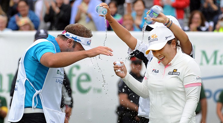 Lydia Ko pours water on Inbee Park and her caddie after Park won the 2014 Manulife Financial LPGA Classic.