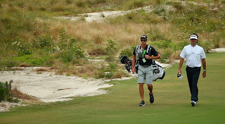 Bubba Watson and caddie Ted Scott during Monday's practice round for the 2014 U.S. Open at Pinehurst No. 2.