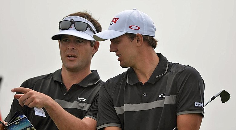 J.C. Deacon (left), with former UNLV player Derek Ernst, was named head men's coach at Florida after spending four season with the Rebels.