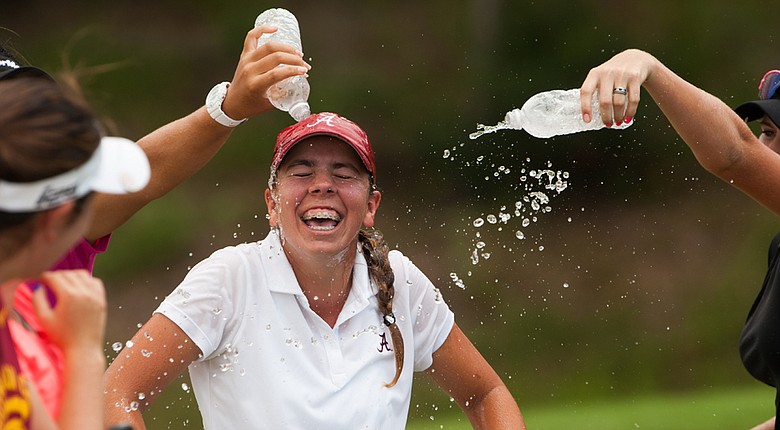 Kristen Gillman is sprayed with water bottles after winning the 2014 Junior PGA Championship.