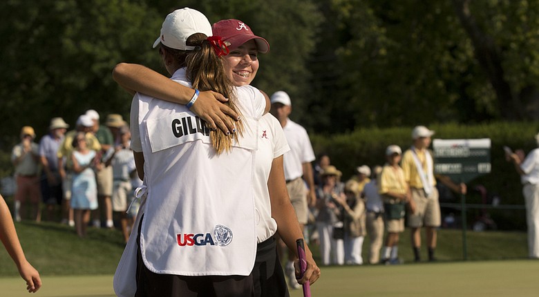 Kristen Gillman receives a hug from her caddie/sister Emily after winning the U.S. Women's Amateur on Sunday.