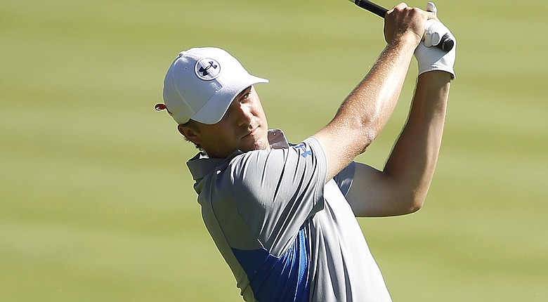 Jordan Spieth hits his second shot on the 14th hole during the first round of the Deutsche Bank Championship.