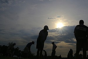 Players prepare to take the course for more play at 7:15 p.m. at the 68th U. S. Junior Amateur Championship at Colleton River Plantation Club.