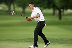 Jonah Texeira tries to coax his putt to fall during the U. S. Men's Amateur at Olympia Fields in Olympia Fields, Ill.