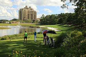 Girls wait at No. 18 on Tranquilo Golf Club at Four Seasons Resort during the Golfweek International Junior.