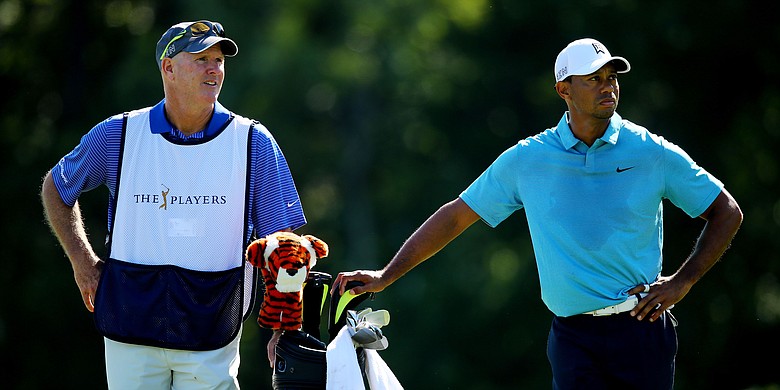 Joe LaCava and Tiger Woods, shown at the 2015 Players Championship